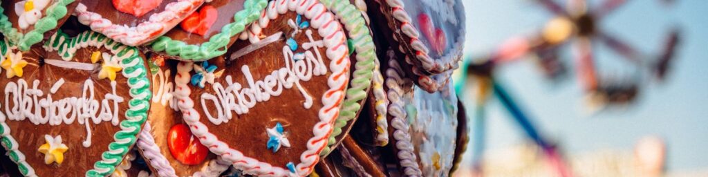 Oktoberfest gingerbread hearts hanging at a fairground stall