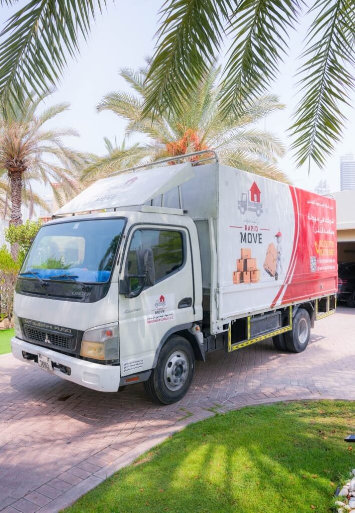 Rapid Move truck parked at a Dubai villa community on moving day
