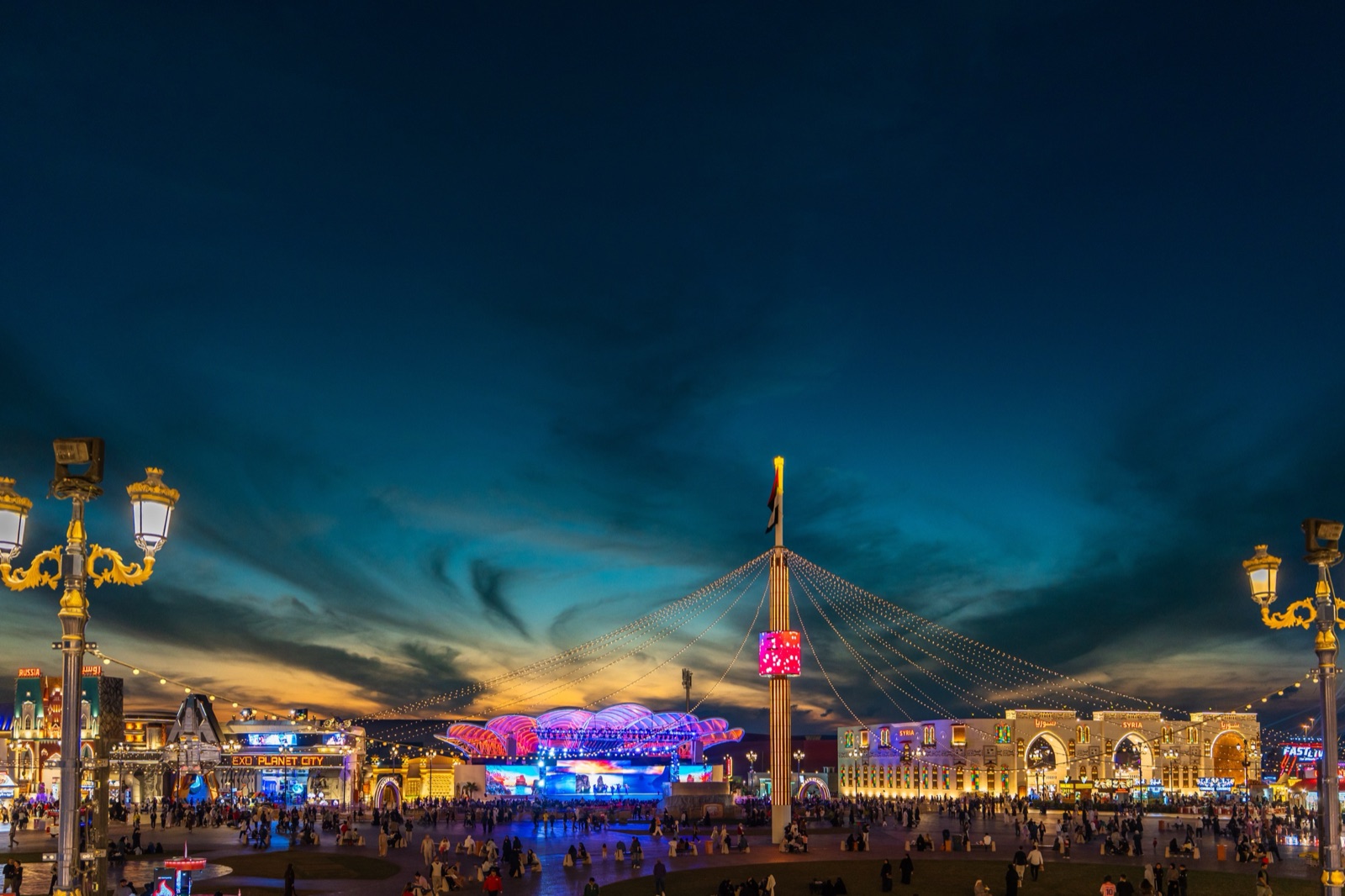 Main stage plaza at Global Village Dubai at dusk