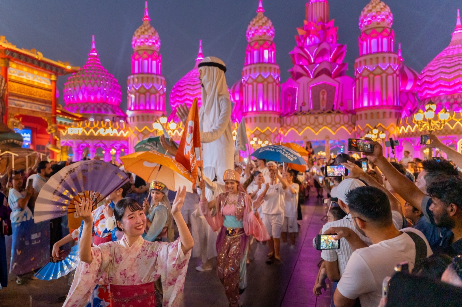 Performers in costumes from around the world in the Parade of the World at Global Village Dubai