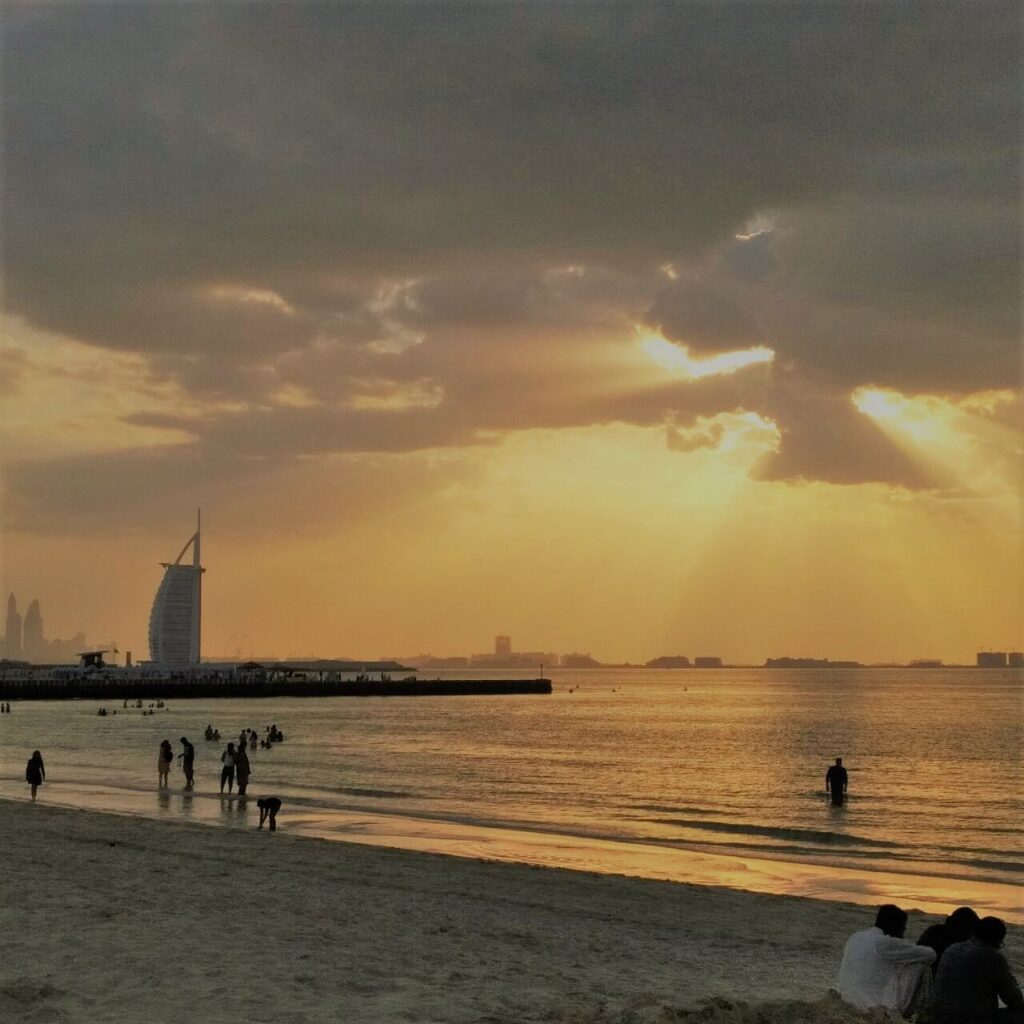 Kite Beach Dubai at dusk with Burj Al Arab in the distance