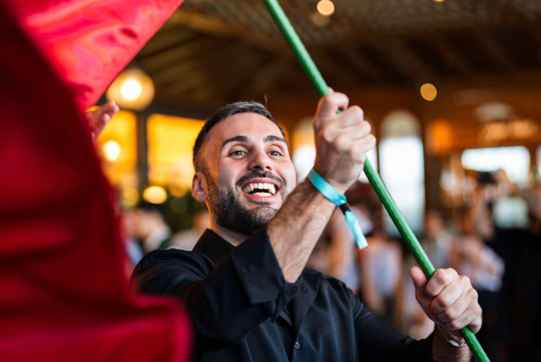 Waiter waving a flag during the Saturday brunch at Signor Sassi Dubai